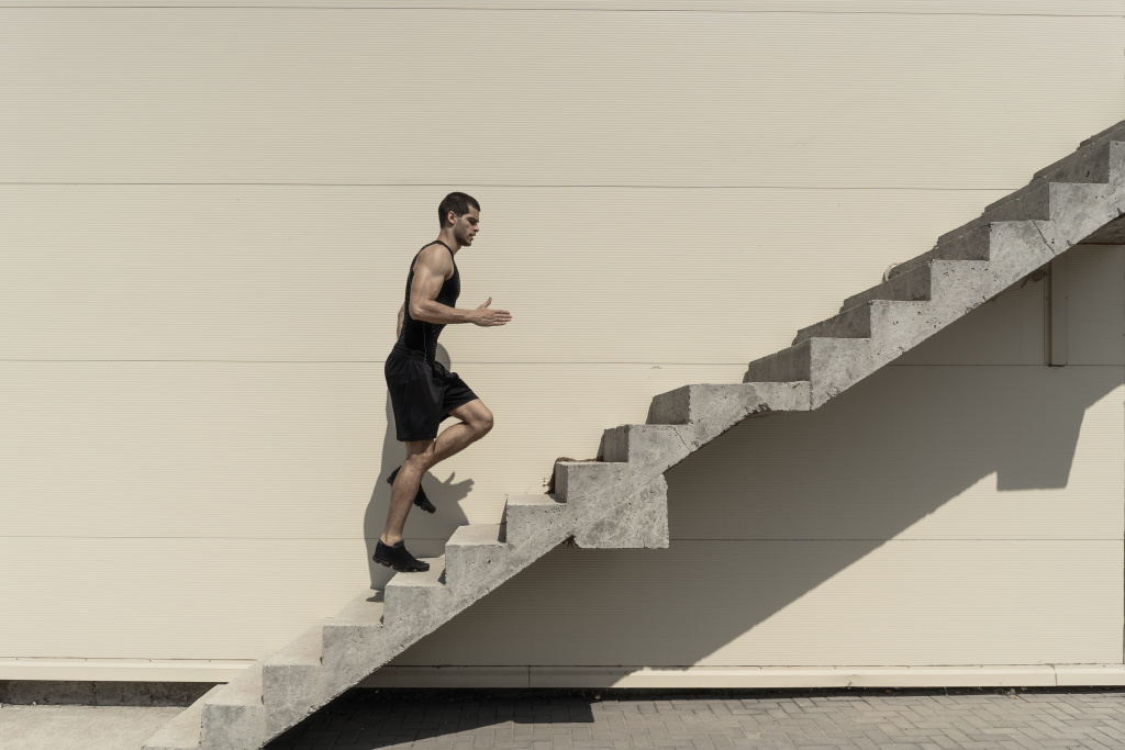 full-length-shot-healthy-athletic-man-climbing-up-stairs.jpg