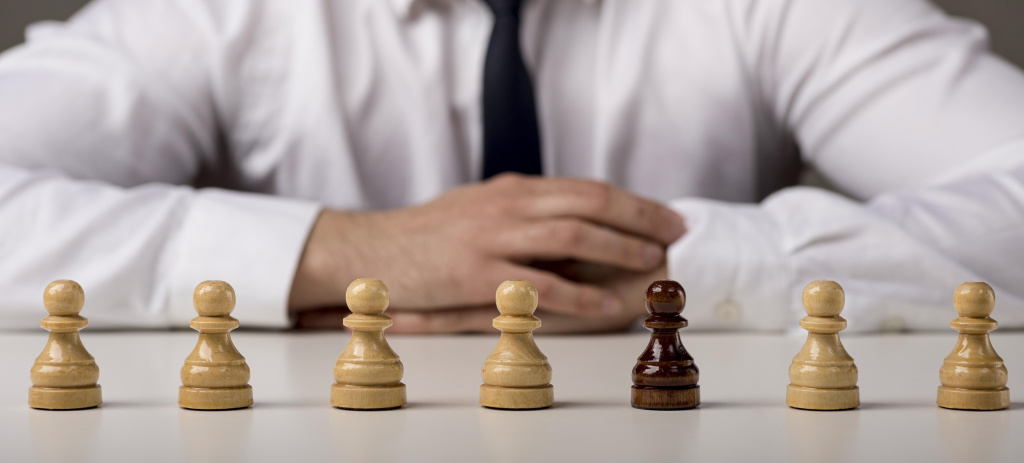 front-view-business-man-with-pawns.jpg